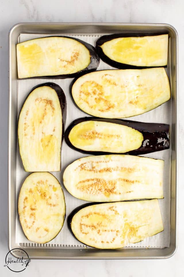 Eggplant slices drizzled with olive oil.