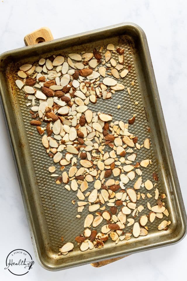Toasted nuts on a sheet pan.