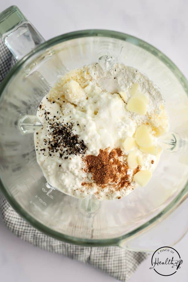 Alfredo with cottage cheese ingredients in a blender.