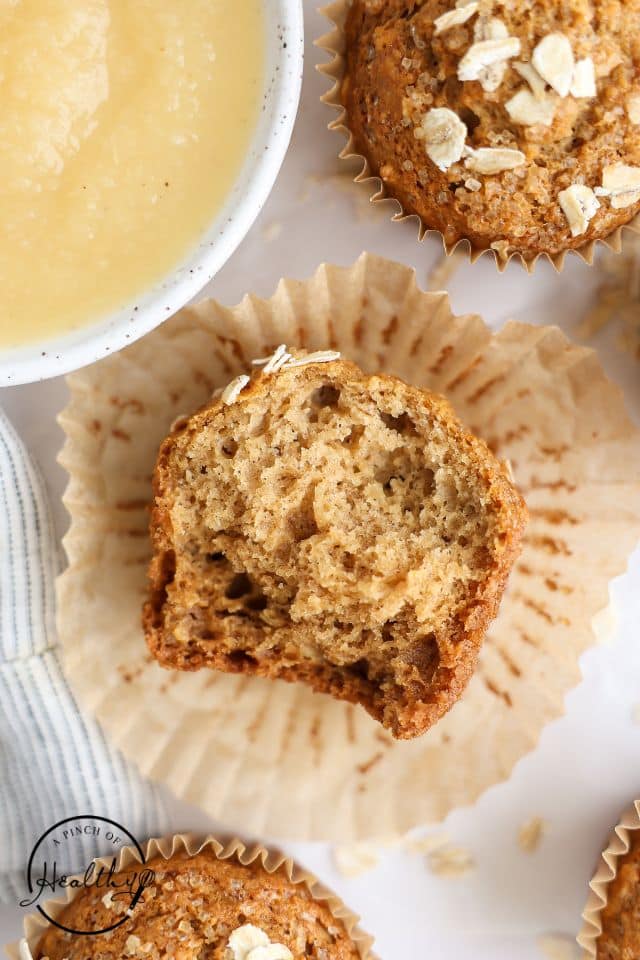 Applesauce muffin torn in half to show the delicate crumb.