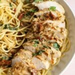 Marry Me Chicken with pasta in a large white bowl.