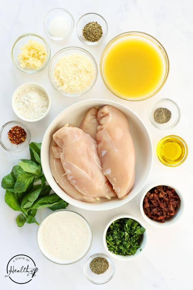 Ingredients for Marry Me Chicken on a white background in separate containers.