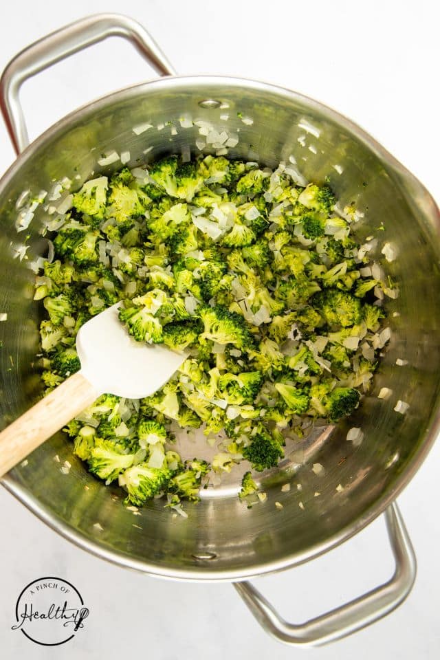 Broccoli in a saucepan after being cooked.