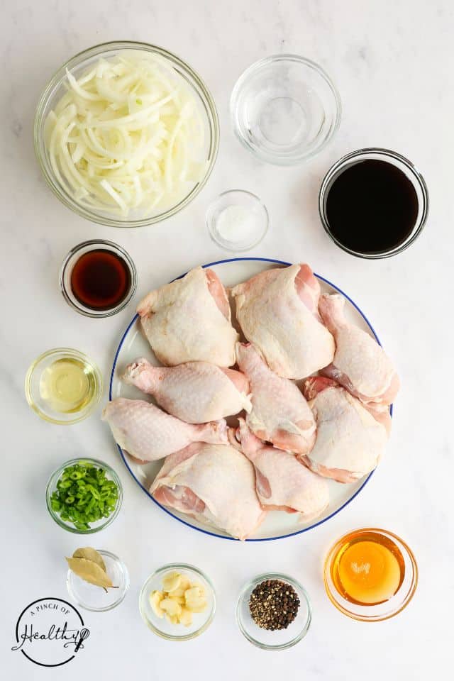 Ingredients for chicken adobo in separate containers.