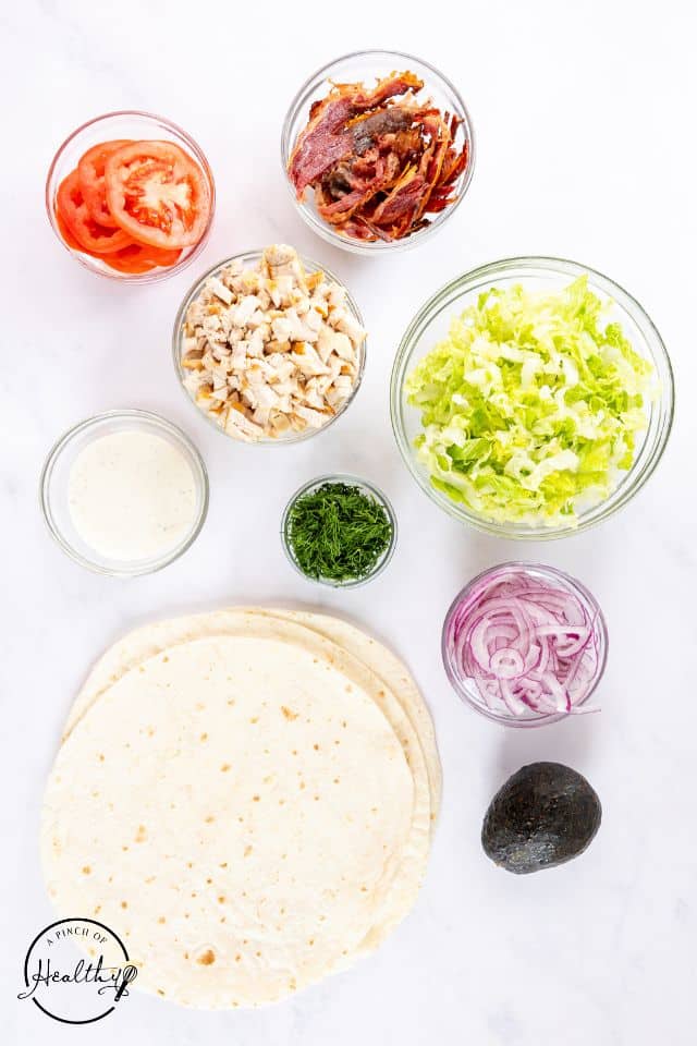 Ingredients for chicken ranch wraps in separate containers.