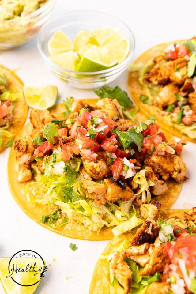 Grilled Chicken street tacos on a white platter.