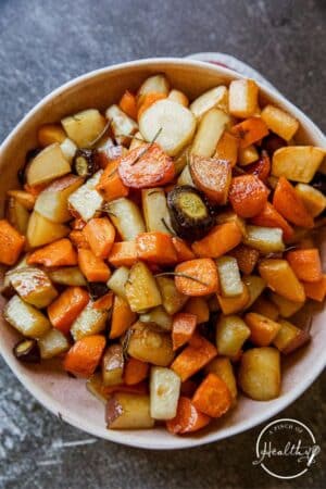 Roasted Root Vegetables in a white bowl.