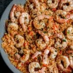 Cajun shrimp and rice in a skillet with parsley on top